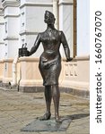 Small photo of YEKATERINBURG, RUSSIA - JULY 20, 2015: Sculpture of conductress with two glasses of tea next to Old railway station building. The sculpture by Yury Krylov and Alexander Koroteev was installed in 2003.