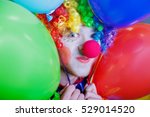 Clown With A Bunch Of Colorful...