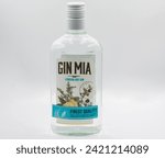 Small photo of Kyiv, Ukraine - September 16, 2023: Studio shoot of Gin Mia London dry gin bottle closeup against white. Gin is a distilled alcoholic drink that derives its predominant flavor from juniper berries.