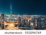 Fantastic nighttime skyline with illuminated skyscrapers. Elevated view of downtown Dubai, UAE. Colourful travel background. 