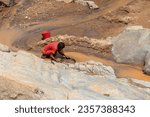 Small photo of Dabalava, Madagascar - November 1, 2022: Local people mine for gems and pan for gold in a river. If they're lucky, they'll find a little gold flake