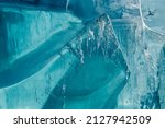 Small photo of Ice Block Ice is water frozen into a solid state. Depending on the presence of impurities. it can appear transparent or a more or less opaque bluish-white color