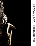 Small photo of Saxophone player. Saxophonist sax jazz orchestra instrument hands isolated on black background close up