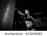 Female Athlete Boxer Punching A ...