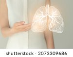 Small photo of Unrecognizable female patient in white clothes, highlighted handrawn lungs. Human respiratory system issues concept.