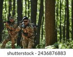 Small photo of A specialized military antiterrorist unit conducts a covert operation in dense, hazardous woodland, demonstrating precision, discipline, and strategic readiness