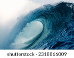 Teahupo'o wave breaking hard over the coral reef