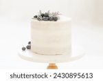 natural white cake with blueberry lavender garnish