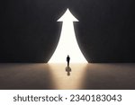 Back view of businessman silhouette in abstract concrete interior with upward arrow opening. Success, financial growth and future concept
