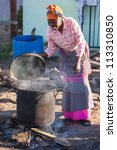 An African Woman Is Making Food ...