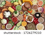 Small photo of Vegan health and super food plant based diet with a large collection of foods. High in protein, vitamins, minerals, antioxidants, anthocynins, fibre, omega 3, lycopene and smart carbs. Ethical eating.