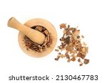 Small photo of Saw palmetto herb used in herbal plant medicine to treat impotence, low libido, prostrate problems, toothache, muscle waste and fatigue. In a mortar on white background. Flat lay top view, copy space.