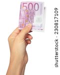 hand with euro banknote | Shutterstock . vector #230817109