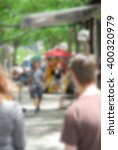 Small photo of A hot dog stand in the city - blurred - ideal for non obtrusive backgrounds