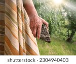 Small photo of Closeup back view past senior age retro dirty rough jew elder palm beat hit up hate Abel martyr die history scene. Evil hatred sin guy grasp grip rock hunt dead hurt Stephen Paul field grass sky story