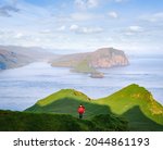 a tourist walks on the island... | Shutterstock . vector #2044861193