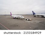 Small photo of Almaty, Kazakhstan - 03.16.2022 : The plane of the Mongolian airline Hunnu Air is parked at the airport site.