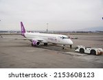 Small photo of Almaty, Kazakhstan - 03.16.2022 : The plane of the Mongolian airline Hunnu Air is parked at the airport site.