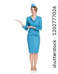 Small photo of Portrait of charming stewardess wearing in blue uniform. Isolated on white background.
