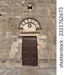 Small photo of Campiglia Marittima, Livorno, Italy - June 12, 2023: Main access door of the Pieve di San Giovanni, tympanum and architrave above the western portal