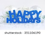 Inscription of happy holidays with christmas decorations