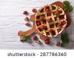 homemade strawberry pie on a table. horizontal view from above, rustic style

