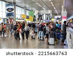 Small photo of AMSTERDAM, NETHERLANDS - JULY 11, 2017: Passenger crowd at Schiphol Airport in Amsterdam. Schiphol is the 12th busiest airport in the world with more than 63 million annual passengers.