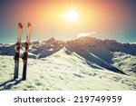 Skis in snow at mountains