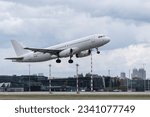 Small photo of Riga, Latvia - July 3, 2023: Avion Express Airbus A320-232 9H-AMK takes off from RIX International Airport.