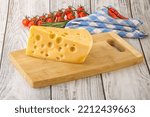Small photo of Maasdam organic cheese piece over board