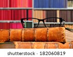 Old Books And Eye Glasses With...