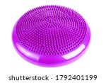 Small photo of Purple inflatable balance disk isoleated on white background, It is also known as a stability disc, wobble disc, and balance cushion.