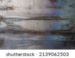 Small photo of raw flat sheet steel texture and background with stains and discoloration.