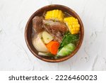 Small photo of Photo of freshly cooked Filipino food called Beef Bulalo or beef bone marrow with mixed vegetables in beef broth.