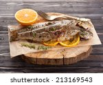 Baked trout fish with thyme and orange 