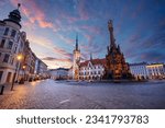Small photo of Olomouc, Czech Republic. Cityscape image of downtown Olomouc, Czech Republic with Olomouc City Hall and Honorary Holy Trinity Column at summer sunrise.