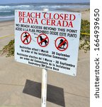 Small photo of Vandenberg Air Force Base, California, USA- March 5, 2020: A beach restriction sign limiting public beach access to areas of Surf Beach, California during the western snowy plover nesting season.