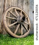 Old Wooden Wagon Wheel Resting...