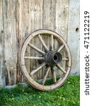 Old Wooden Wagon Wheel Resting...