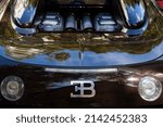 Small photo of Miami, Florida USA - February 20, 2022: Close up view of the rear of a exotic Bugatti supercar on display at the public Miami Concours car show in the upscale Design District.