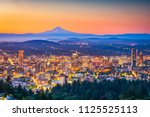Portland, Oregon, USA skyline at dusk with Mt. Hood in the distance.