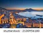 Naples, Italy aerial skyline on the bay with Mt. Vesuvius at dawn.