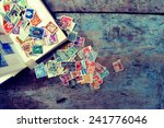 Old Post Stamps On A Wooden...