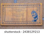Small photo of Skopje, North Macedonia - October 23, 2023: Bronze Memorial Plaque at Birthplace of Mother Theresa House in Capital City Centre.