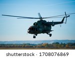 Military helicopter flying during exercise performing a military demonstration