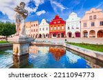 Telc, Czech Republic. Main square of Telc with its famous 16th-century colorful houses, a UNESCO World Heritage Site, on a sunny day with blue sky and clouds, historical Moravia.