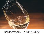 Pouring White Wine From A...