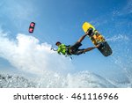 A Kite Surfer Rides The Waves 