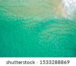 Aerial Of Surfers In The Ocean...