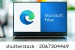 Small photo of POZNAN, POL - JUL 3, 2021: Laptop computer displaying logo of Microsoft Edge, a web browser developed by Microsoft